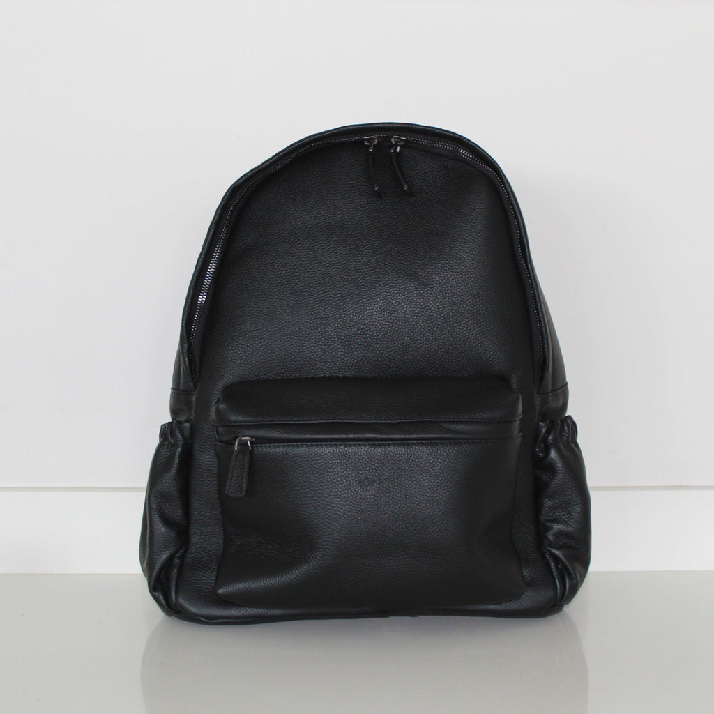 Black genuine leather backpack  handbag and  on a white background