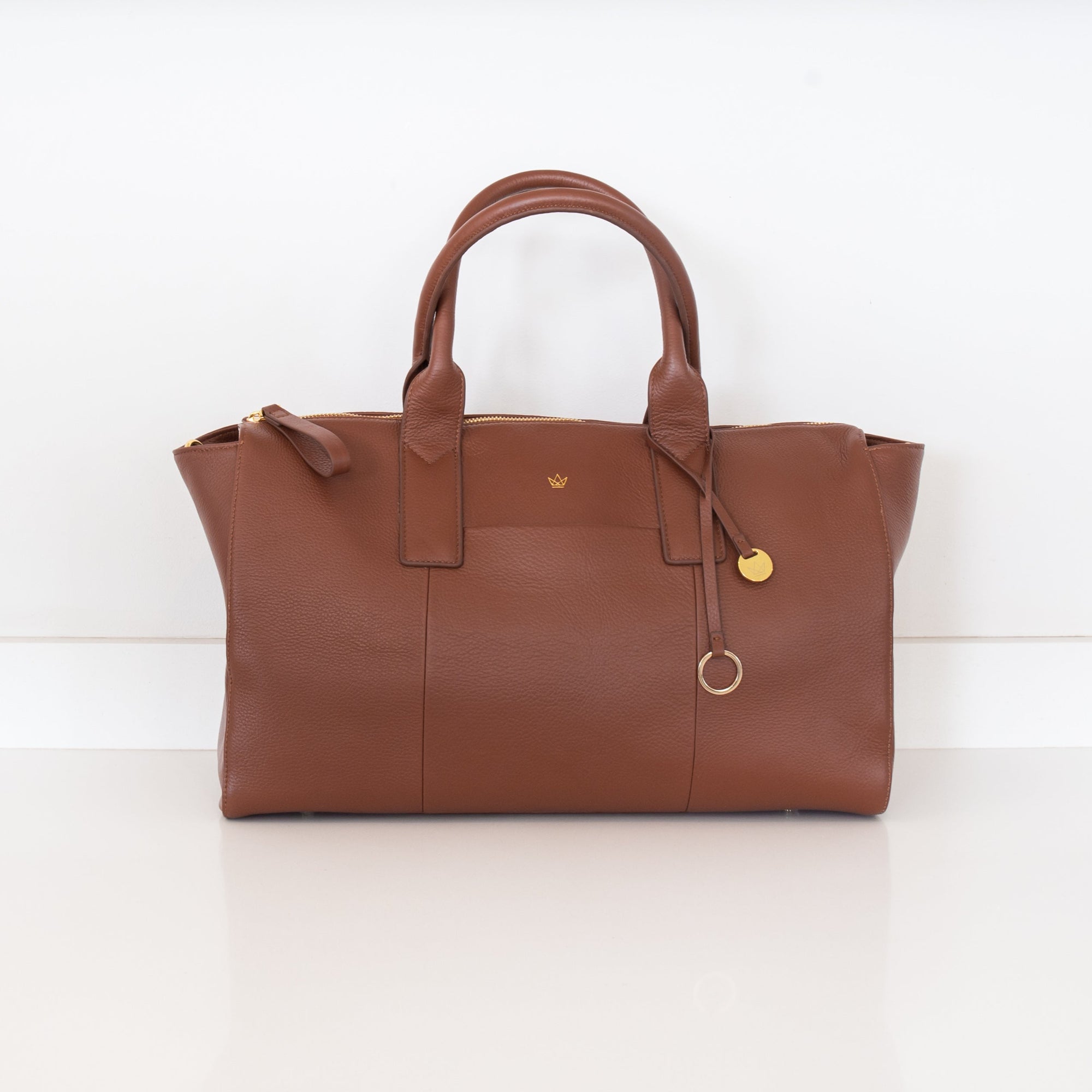 Genuine Leather Tan colour leather handbag on a white background